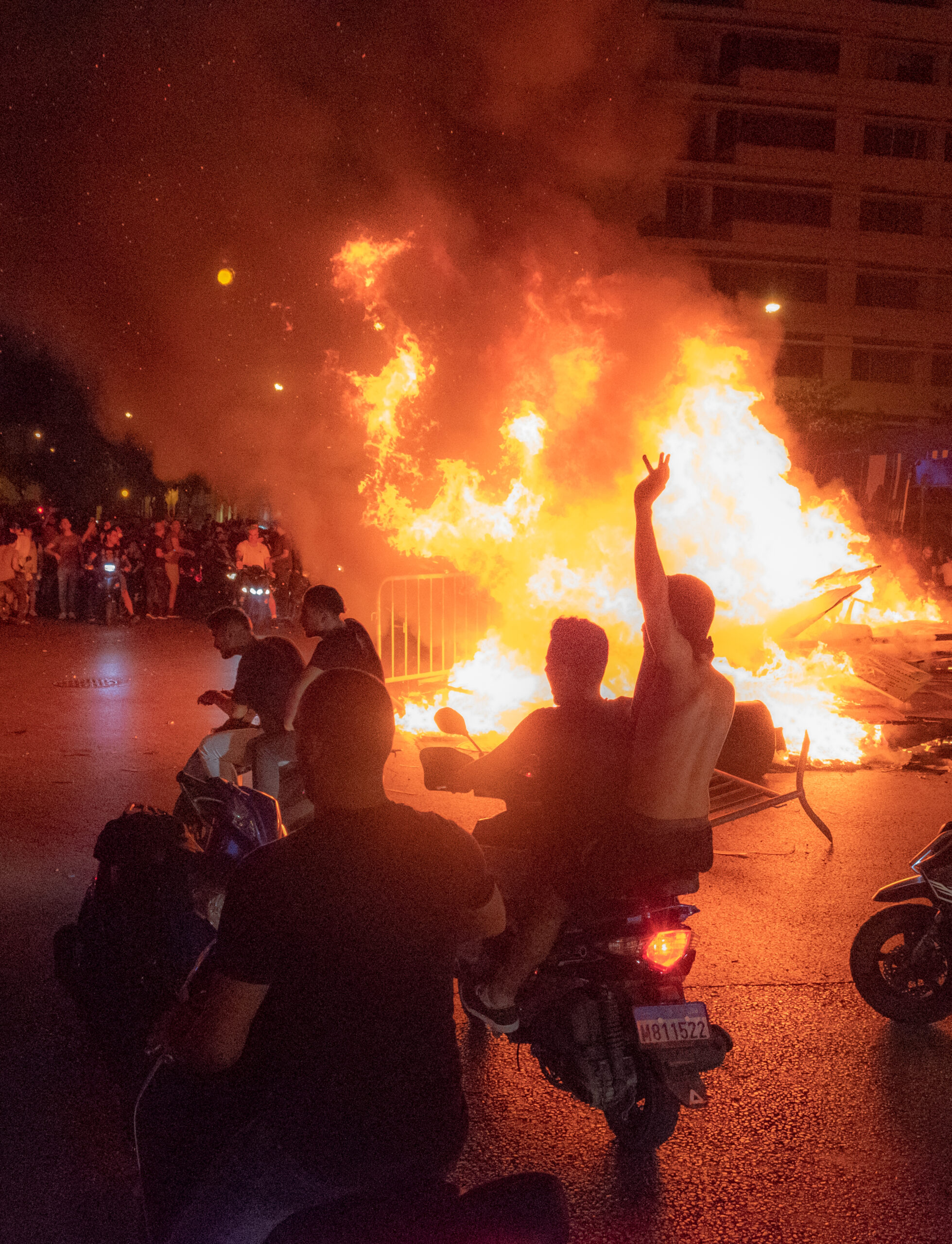 th_cak-00002 Beeping motorcycles going around the fire pit in Downtown Beirut. 17 October 2019.